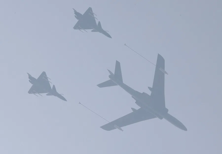 In this file photo taken on 22 September 2019, planes from the Chinese PLA air force fly during a rehearsal of the military parade on 1 October to mark the 70th anniversary of the founding of the People's Republic of China, in Beijing, China. (Jason Lee/File Photo/Reuters)