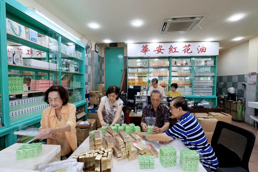 Chop Wah On’s third-generation owners helping out in the store. Pictured here are (front row, from left) Tong Kok Kong’s wife, Tong Pui Cheng, Tong Kok Wing and Tong Kok Kong, as well as (back row, from left) Tong Kok Kai and his wife. (Long Kwok Hong/SPH Media)