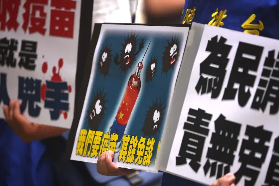 ​People hold placards calling for the Taiwan government to allow the use of Covid-19 vaccines from China, in front of the Taiwan Centers for Disease Control building, following a recent spike in coronavirus disease infections in Taipei, Taiwan, 24 May 2021. Placard reads: "We want vaccines, there is nothing more to talk about." (Ann Wang/Reuters)