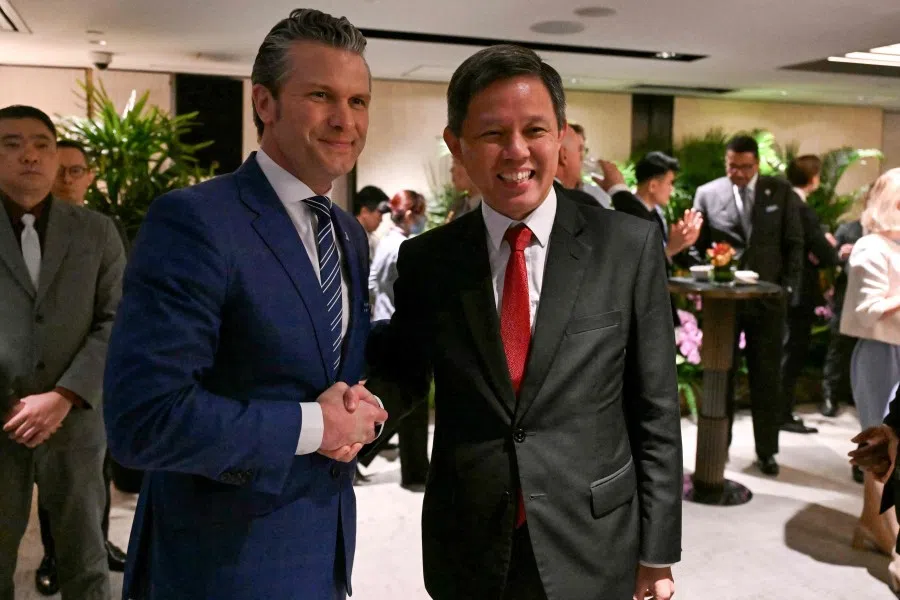 US Defence Minister Pete Hegseth (left) is greeted by Singapore Defence Minister Chan Chun Sing at a ministerial roundtable during the Shangri-La Dialogue summit in Singapore on 31 May 2025. (Mohd Rasfan/AFP)