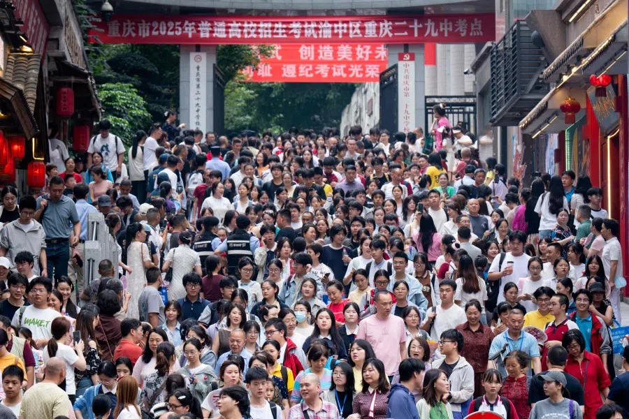 Students walk out to meet their parents after sitting China’s National College Entrance Examination (NCEE), known as “gaokao”, on 7 June 2025. Nationwide, 13.35 million students registered for the multi-subject “gaokao” series this year, according to the Ministry of Education, down from last year’s record-high 13.42 million test takers. (AFP)