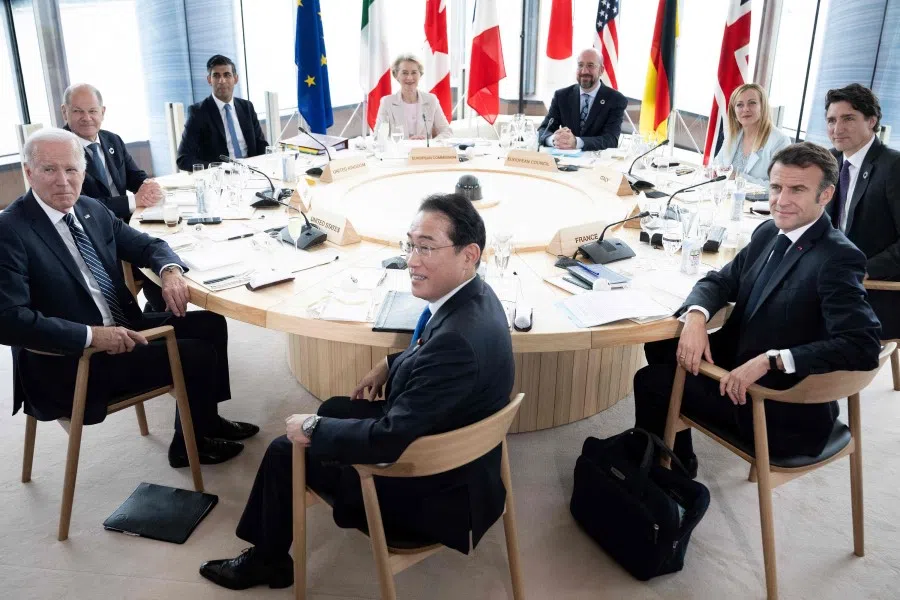 (Clockwise left to right) US President Joe Biden, Germany's Chancellor Olaf Scholz, UK Prime Minister Rishi Sunak, European Commission President Ursula von der Leyen, President of the European Council Charles Michel, Italy's Prime Minister Giorgia Meloni, Canada's Prime Minister Justin Trudeau, France's President Emmanuel Macron and Japan's Prime Minister Fumio Kishida attend a meeting during the G7 Leaders' Summit in Hiroshima on 19 May 2023. (Brendan Smialowski/AFP)