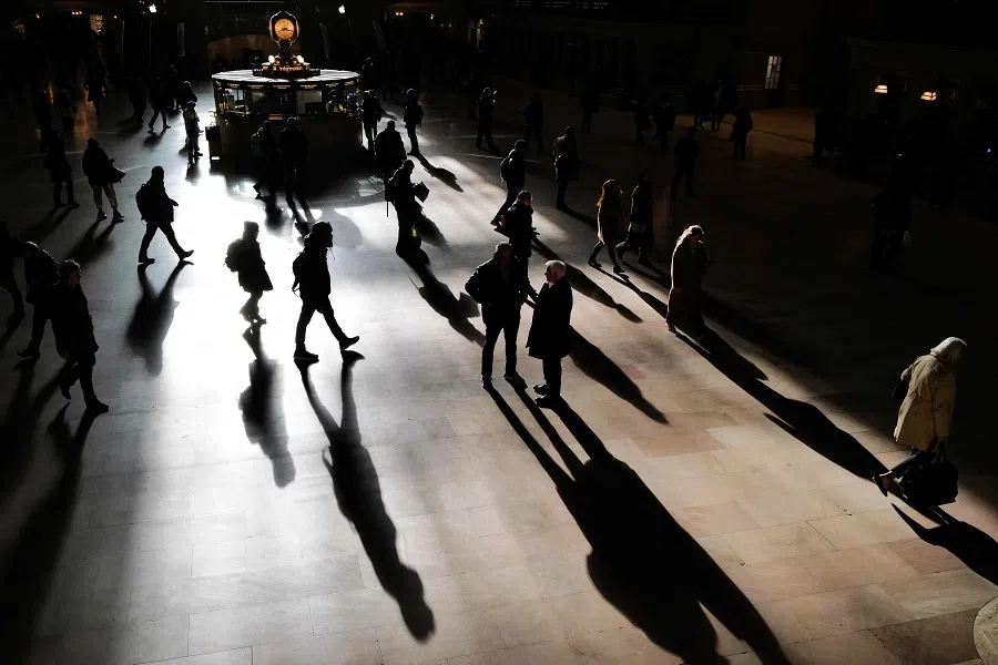 Pedestrians make their way early morning in the hallway of the Grand Central terminal in New York on 29 February 2024. (Charly Triballeau/AFP)