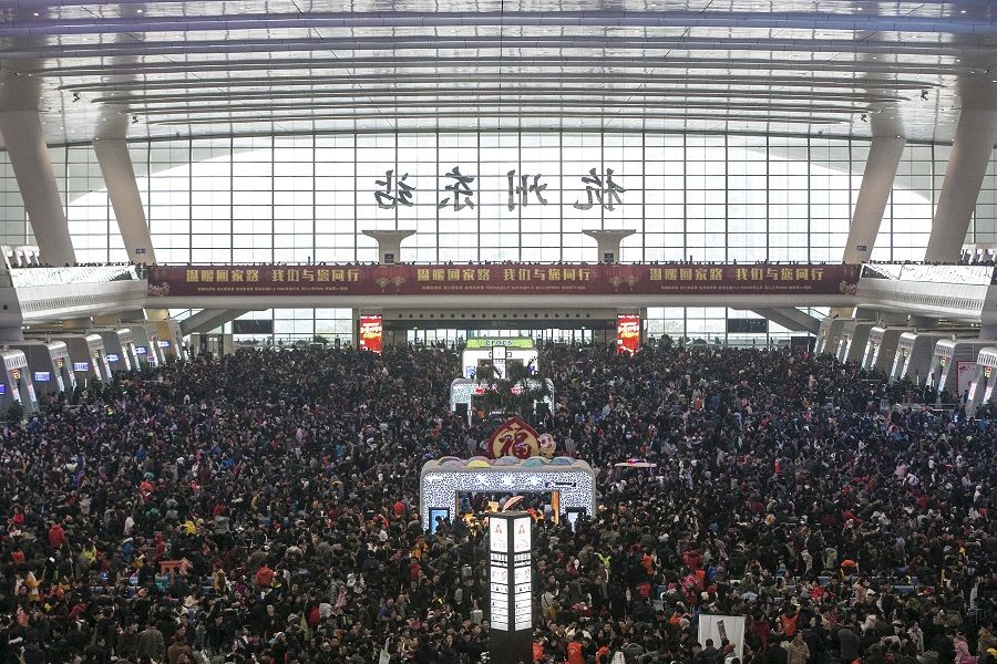 Passengers crowd at the waiting hall inside a railway station after trains were delayed due to heavy snow, during the travel rush ahead of the upcoming Spring Festival, in Hangzhou, Zhejiang province, 1 February 2016. (Reuters/Stringer)