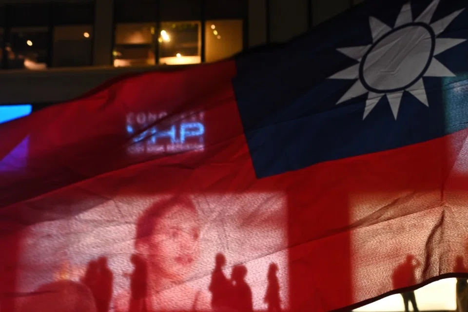 A Taiwanese flag is seen as people attend a rally to mark Taiwan's Double Ten Day. (Philip Fong/AFP)