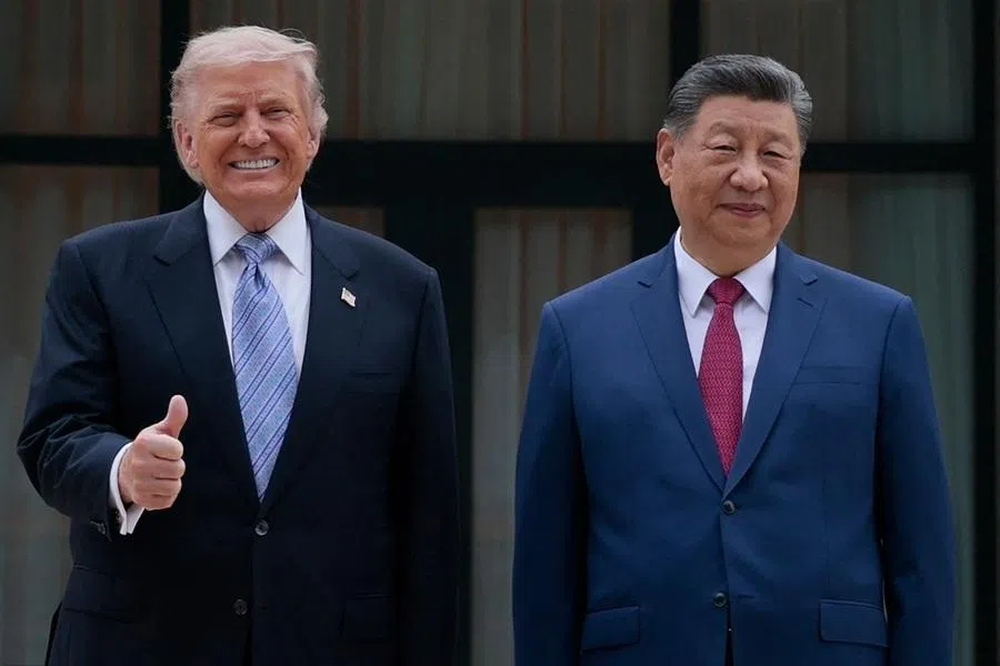 US President Donald Trump poses for photos with Chinese President Xi Jinping during a visit to Zhongnanhai Garden in Beijing on 15 May 2026. (Evan Vucci/Pool/AFP)