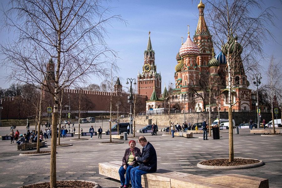 People enjoy a warm spring day at the Zaryadye Park near the Kremlin in Moscow, Russia, 13 April 2021. (Dimitar Dilkoff/AFP)