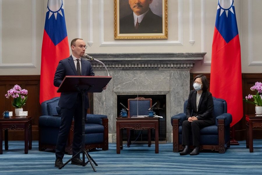 Matas Maldeikis, leader of the Lithuanian parliament's Taiwan Friendship Group, speaks next to Taiwan President Tsai Ing-wen during a meeting with a delegation of lawmakers from Lithuania, Latvia, and Estonia, at the Presidential Office in Taipei, Taiwan, 29 November 2021. (Taiwan Presidential Office/Handout via Reuters)