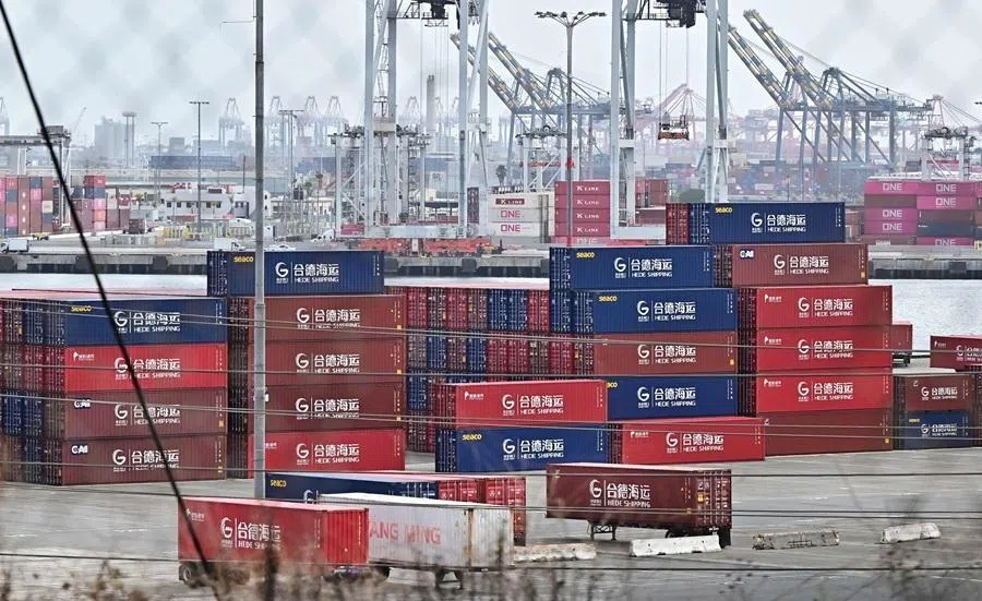 Shipping containers from Hede Shipping, from the Chinese state-owned Hebei Port Group, are seen stacked at the Port of Los Angeles in Los Angeles, California, 13 October 2025.