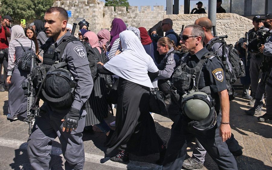 Israeli security forces disperse Palestinian protesters outside the Damascus gate in east Jerusalem on 15 June 2021, ahead of the 'March of the Flags' which celebrates the anniversary of Israel's 1967 occupation of the city's eastern sector. (Ahmad Gharabli/AFP)