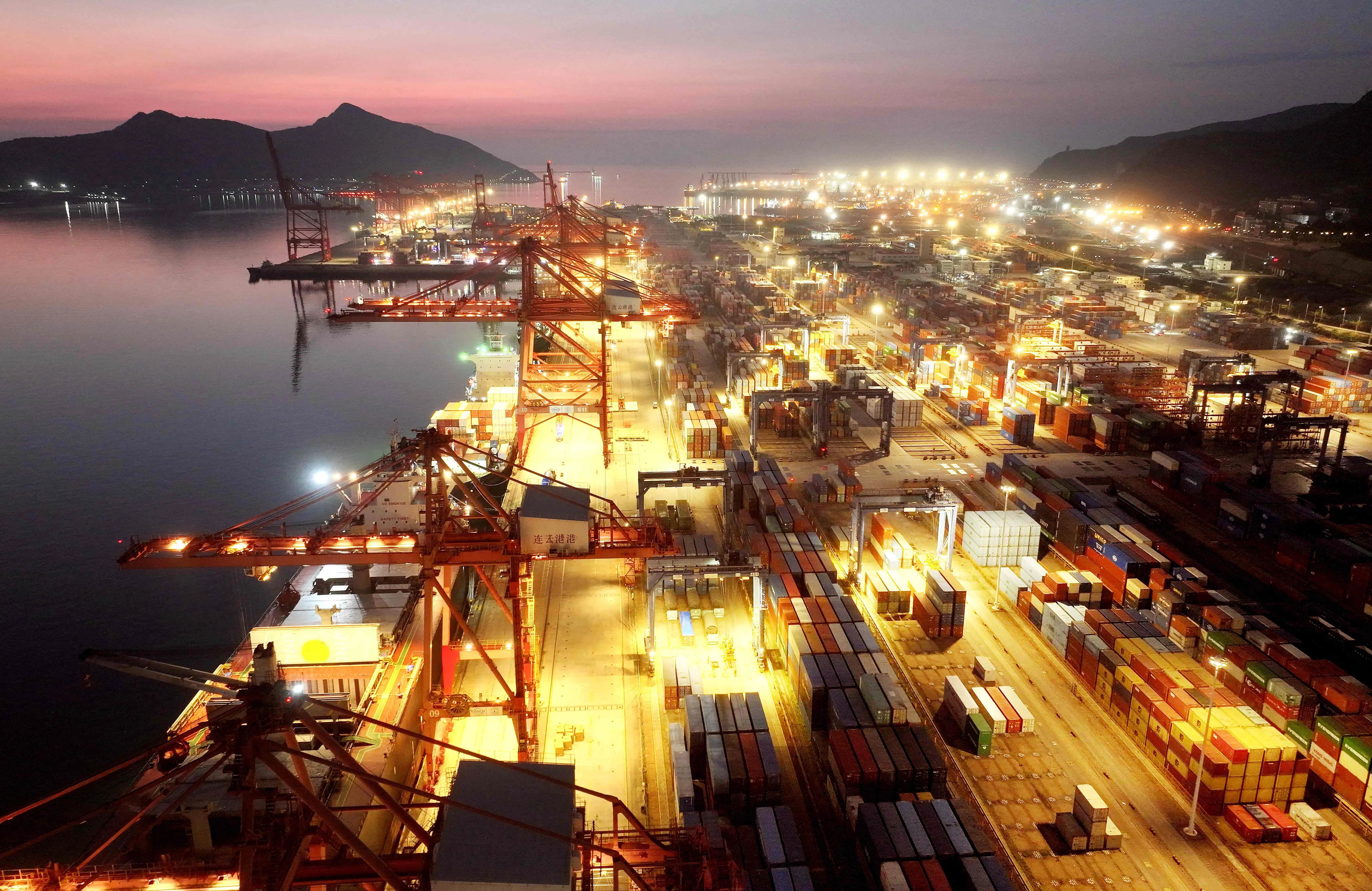 Shipping containers are seen at the cargo port in Lianyungang, Jiangsu province, China, on 7 August 2026.
