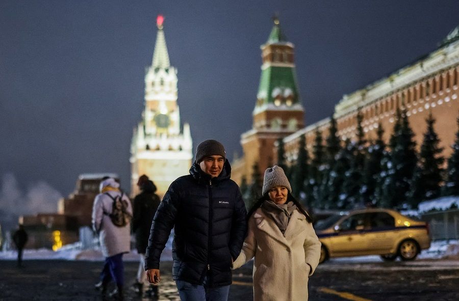 People walk at the Red Square, in Moscow, Russia, 8 February 2022. (Maxim Shemetov/Reuters)