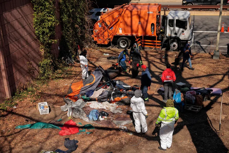 City officials and law enforcement clear out a homeless encampment near the US State Department on 7 March 2025 in Washington, DC. (Chip Somodevilla/AFP)