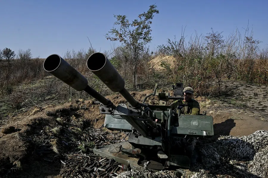 A Ukrainian serviceman operates a ZU-23-2  anti-aircraft cannon during a combat shift near a frontline, amid Russia’s attack on Ukraine, in Zaporizhzhia region, Ukraine, 21 September 2024. (Stringer/Reuters)