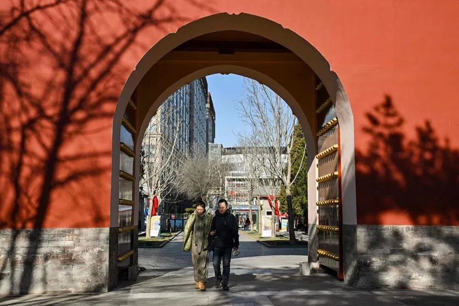 A couple visits a park in Beijing on 3 January 2026. (Adek Berry/AFP)