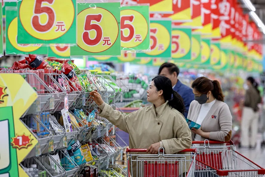People shopping at a supermarket in Zaozhuang, in eastern China’s Shandong province on 10 April 2025.