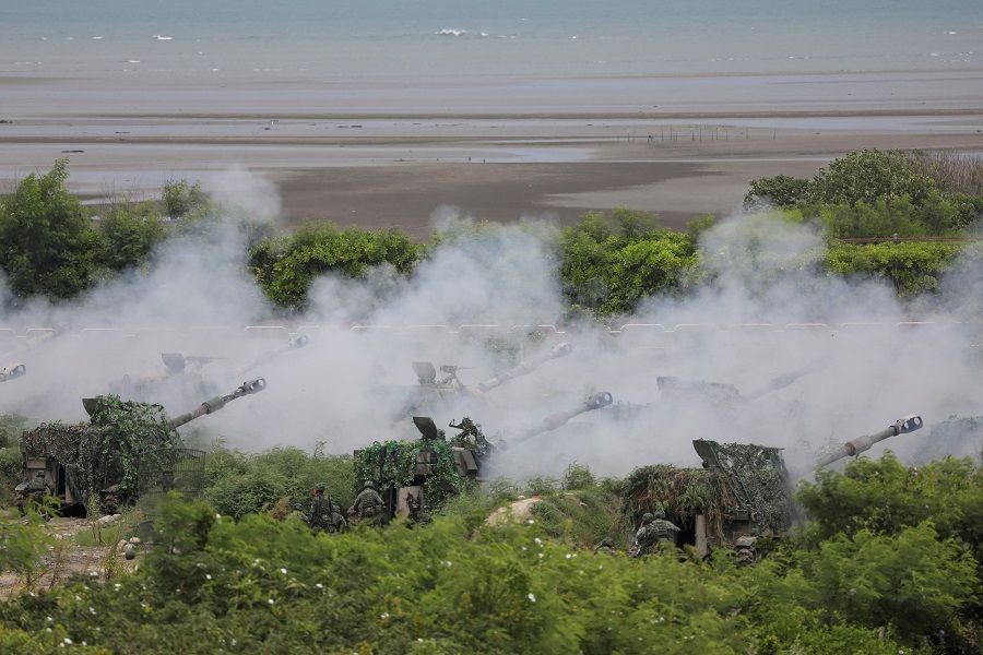 Soldiers fire M109A2 155mm howitzers during the live-fire, anti-landing Han Kuang military exercise, which simulates an enemy invasion, in Taichung, Taiwan, 16 July 2020. (Ann Wang/File Photo/Reuters) To match Special Report TAIWAN-CHINA/CHIPS