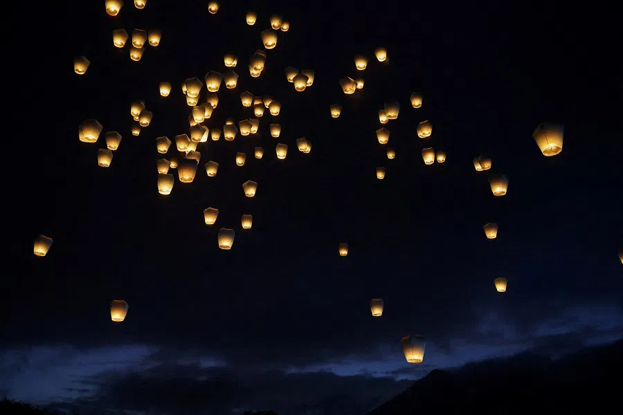 Sky lanterns are released in New Taipei City, Taiwan, on 17 February 2024. (Ann Wang/Reuters)