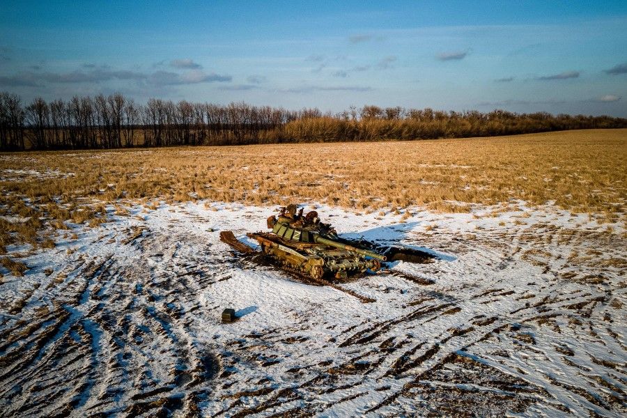 This aerial photograph shows a destroyed Russian tank sitting in a snow-covered wheat field in Kharkiv region on 22 February 2023, amid Russia's military invasion of Ukraine. (Ihor Tkachov/AFP)