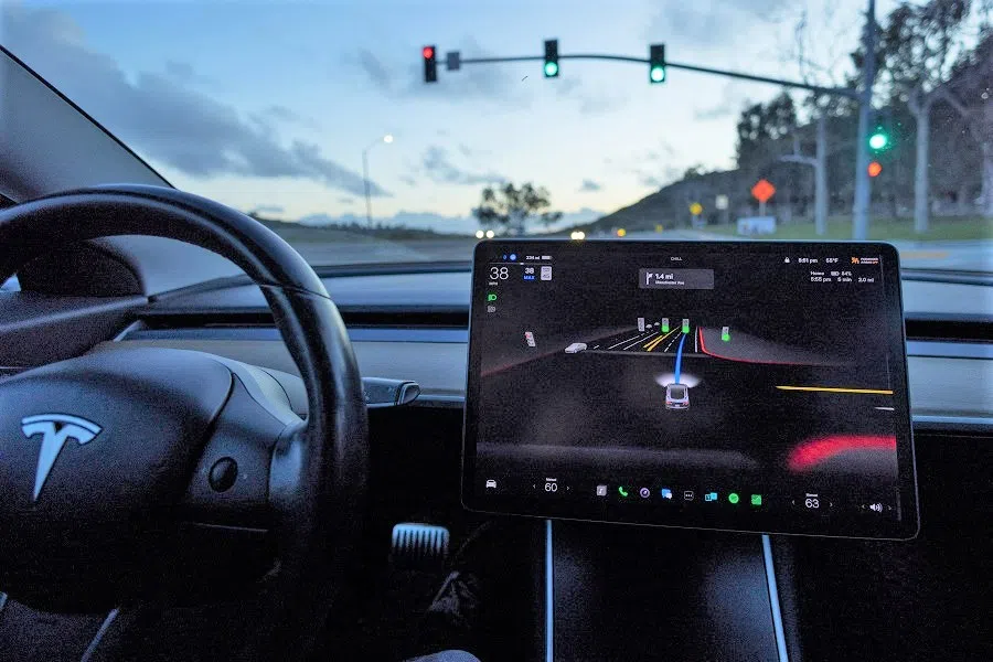 A Tesla Model 3 vehicle is shown using the Autopilot Full Self Driving Beta software (FSD) while navigating a city road in Encinitas, California, US, 28 February 2023. (Mike Blake/Reuters)
