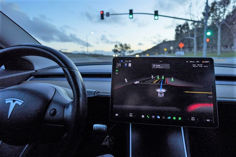 A Tesla Model 3 vehicle is shown using the Autopilot Full Self Driving Beta software (FSD) while navigating a city road in Encinitas, California, US, 28 February 2023. (Mike Blake/Reuters)
