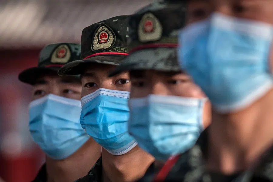 Paramilitary police officers in front of the entrance of the Forbidden City in Beijing, 19 May 2020. (Nicolas Asfouri/AFP)