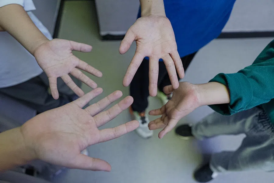 Zhuangzhuang and his classmates show me the calluses on their hands. Breaking involves a lot of palm-supported movements.