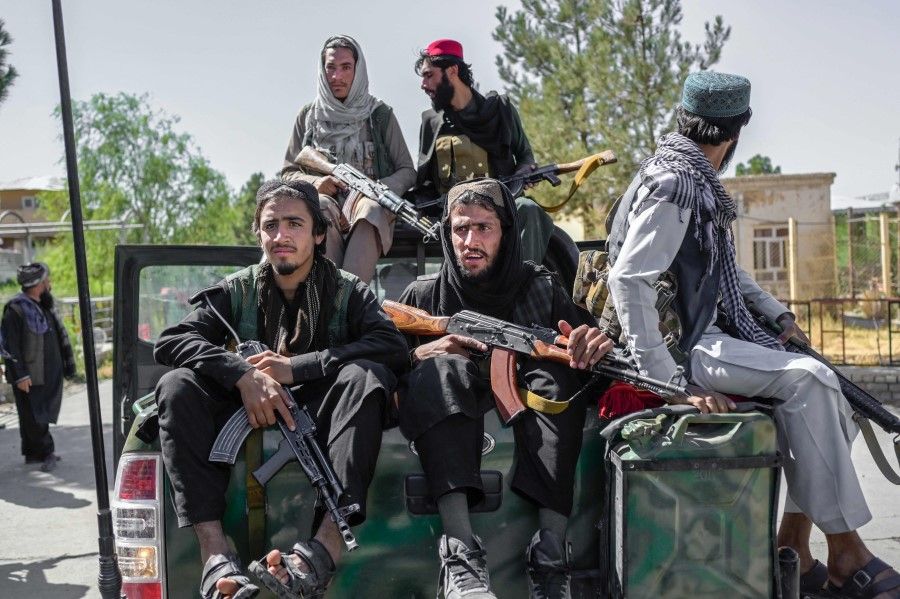 Members of the Taliban drive in the Pul-e-Charkhi prison in Kabul on 16 September 2021. (Bulent Kilic/ AFP)