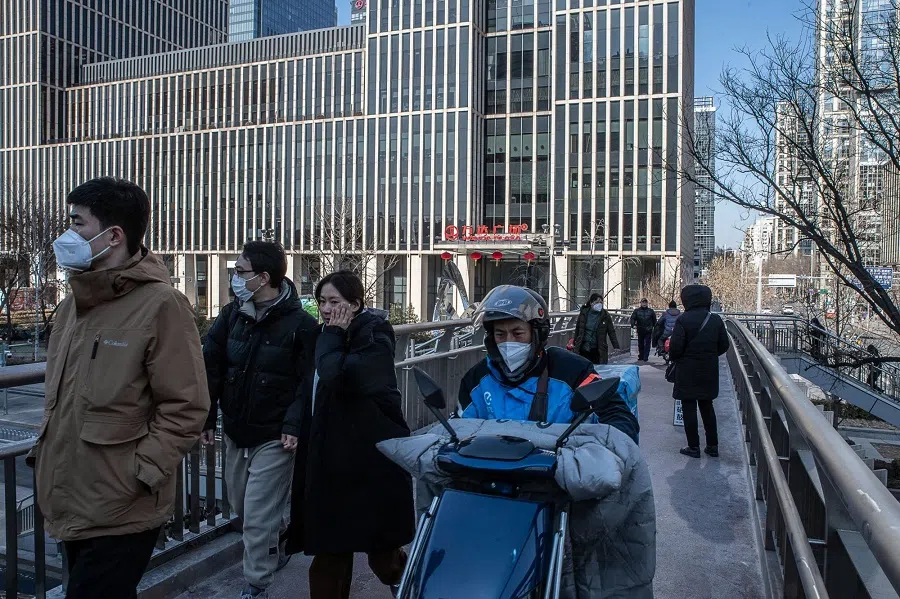 Pedestrians on an overpass in Beijing, China, on 3 February 2023. (Bloomberg)