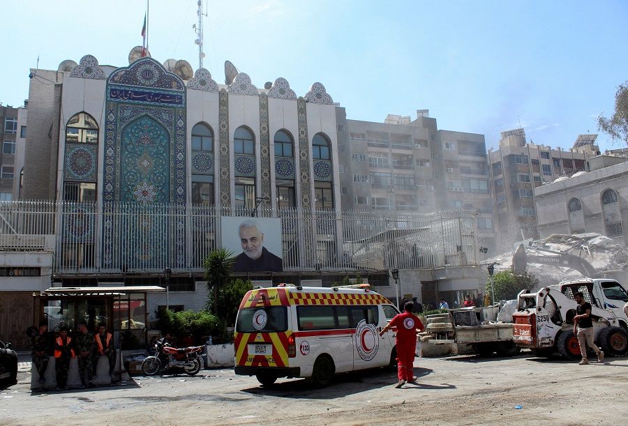 An ambulance is parked outside the Iranian embassy after a suspected Israeli strike on 1 April on Iran's consulate, adjacent to the main Iranian embassy building, in the Syrian capital Damascus, Syria, 2 April 2024. (Firas Makdesi/Reuters)