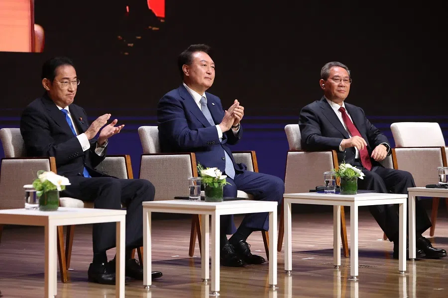 (L-R) Japan’s Prime Minister Fumio Kishida, South Korea’s President Yoon Suk Yeol and China’s Premier Li Qiang attend the business summit at the Korea Chamber of Commerce and Industry in Seoul on 27 May 2024. (Chung Sung-jun/AFP)