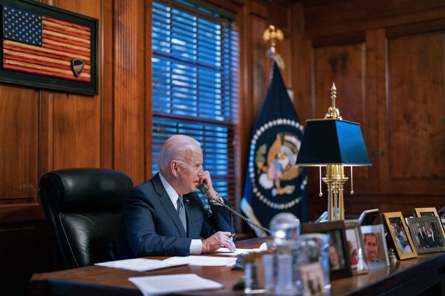 In this image provided by the White House on 30 December 2021, US President Joe Biden speaks on the phone to his Russian counterpart Vladimir Putin on diplomatic solutions to soaring Russia-West tensions over Ukraine, in Wilmington, Delaware, United States. (White House/AFP)