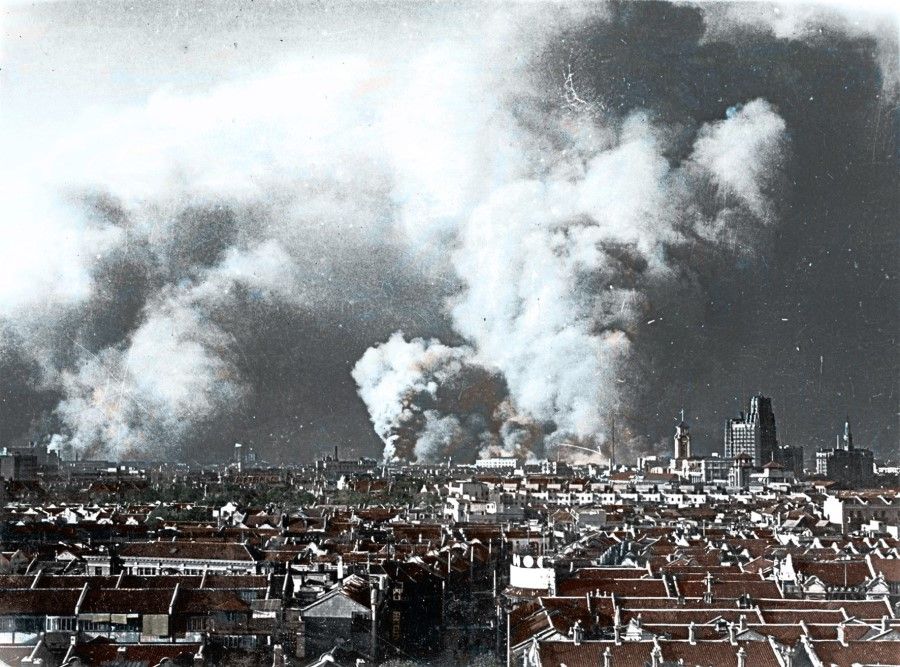 The Zhabei area in Shanghai lit up in flames with smoke rising during the intense Battle of Shanghai, October 1937.