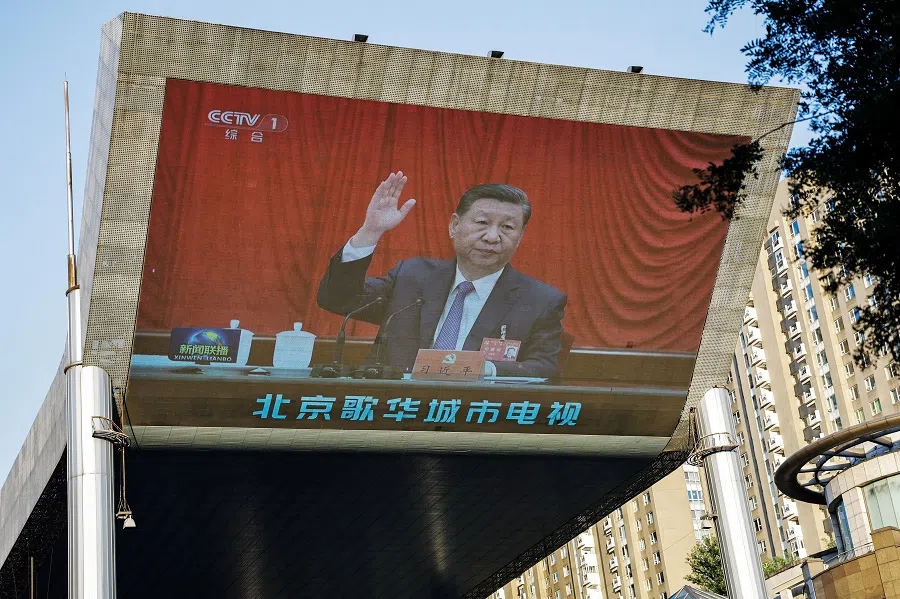 A giant screen shows news footage of Chinese President Xi Jinping attending the third plenary session of the 20th Central Committee of the Communist Party of China (CPC), in Beijing, China, on 18 July 2024. (Tingshu Wang/Reuters)