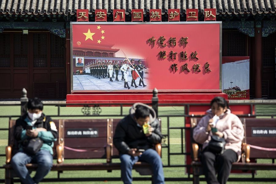 Visitors rest on benches at a People's Liberation Army Flag Guard barrack near the Forbidden City in Beijing, China, on 3 March 2022. (Qilai Shen/Bloomberg)