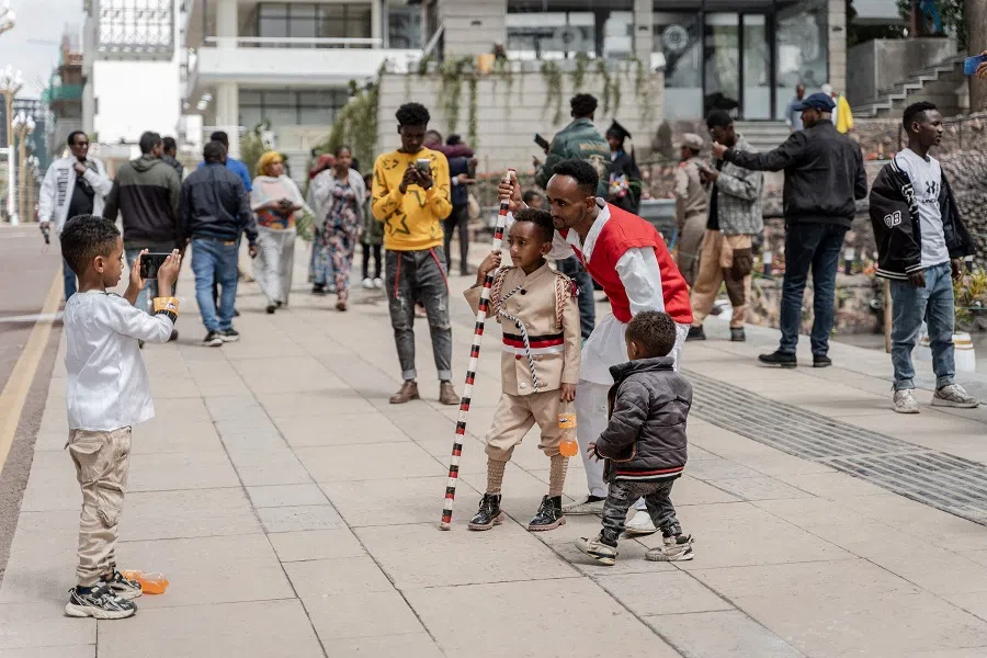 People take photographs at the newly built walkway and bike lane in Addis Ababa, Ethiopia on 27 July 2024.