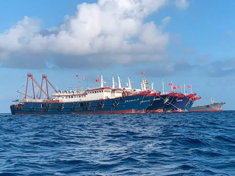 Chinese vessels, believed to be manned by Chinese maritime militia personnel, are seen at Whitsun Reef, South China Sea on 27 March 2021. (Philippine Coast Guard/National Task Force-West Philippine Sea/Handout via Reuters)