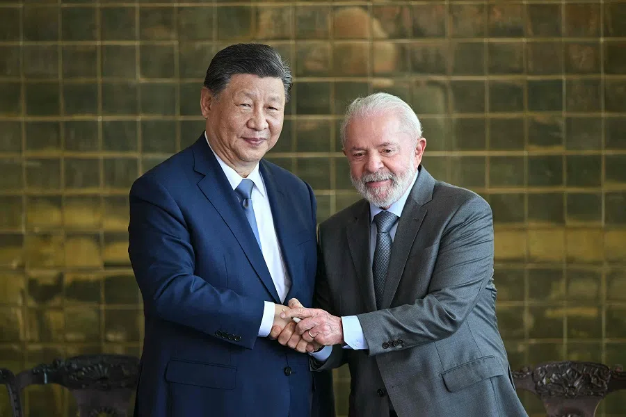 China’s President Xi Jinping shakes hands with Brazil’s President Luiz Inacio Lula da Silva after a meeting at the Planalto Palace in Brasilia on 20 November 2024. (Everisto Sa/AFP)