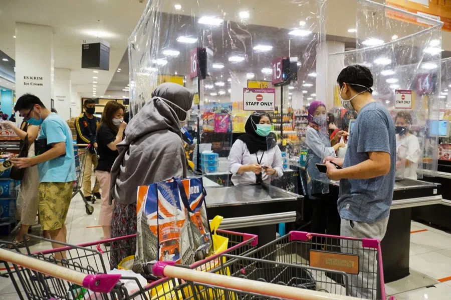 Customers shop at a supermarket in Tangerang, Banten, 29 May 2020. Local-born and migrant Chinese in Indonesia do interact, but not completely integrated. (Fajrin Raharjo/AFP)