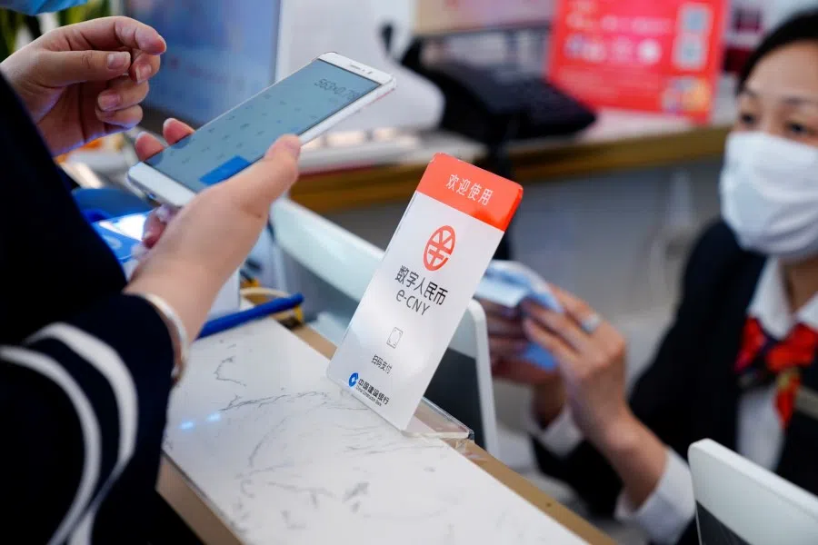 A sign indicating digital yuan, also referred to as e-CNY, is pictured at a shopping mall in Shanghai, China, 5 May 2021. (Aly Song/Reuters)