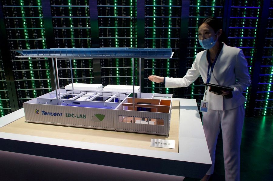 A staff member introduces Tencent's Internet Data Centre cloud computing service during a government-organised media tour to Tencent headquarters in Shenzhen, Guangdong province China, 27 September 2020. (David Kirton/File Photo/Reuters)