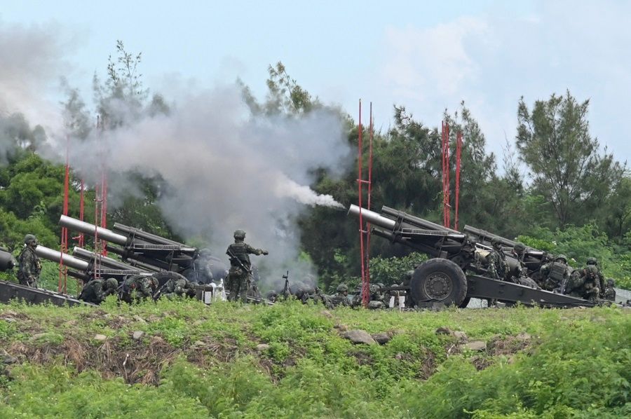 Taiwan military soldiers fire 155-inch howitzers during a live fire anti-landing drill in Pingtung, Taiwan, on 9 August 2022. (Sam Yeh/AFP)