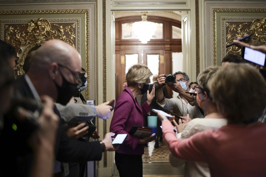 Senator Elizabeth Warren departs from a caucus meeting with Democratic senators after a procedural vote on the debt limit was postponed at the US Capitol Building on 6 October 2021 in Washington, DC. Congress has until 18 October to raise the debt ceiling or risk a default that would have widespread economic consequences. (Anna Moneymaker/AFP)