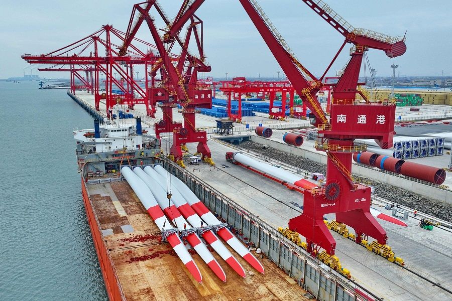 This photo taken on 2 December 2022 shows a cargo ship loaded with wind turbine blades that will be exported at a port in Nantong, Jiangsu province, China. (AFP)