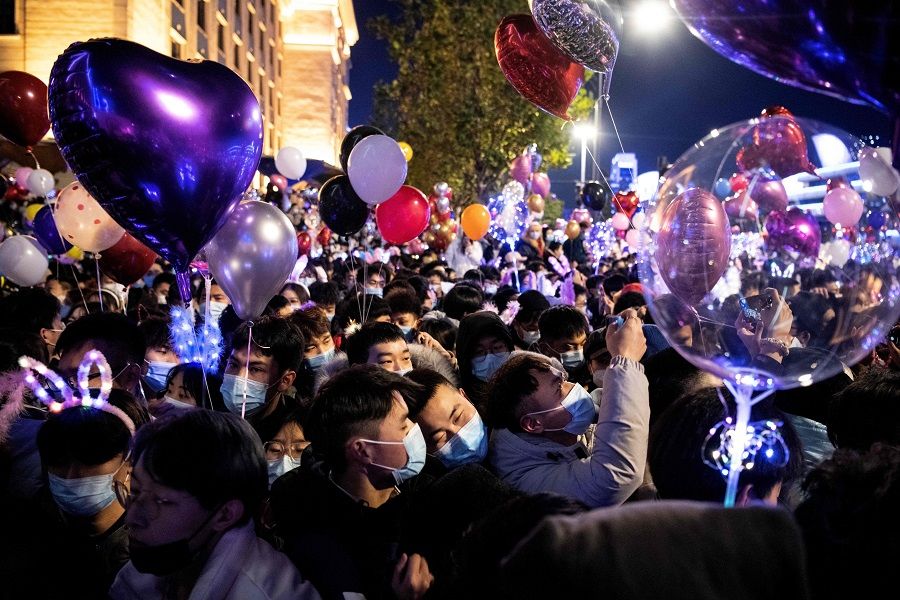 People wearing face masks attend a New Year's countdown in Wuhan, Hubei province, China, on 31 December 2020. (Noel Celis/AFP)