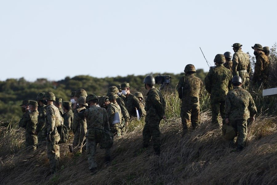 Members of the Japan Ground Self-Defense Force (JGSDF) participate in a joint exercise by the Japan Self-Defense Forces (JSDF) on Tanegashima island in Kagoshima, Japan, on 25 November 2021. Japan has openly expressed concerns about tensions across the Taiwan Strait and their effect on regional security. (Kiyoshi Ota/Bloomberg)