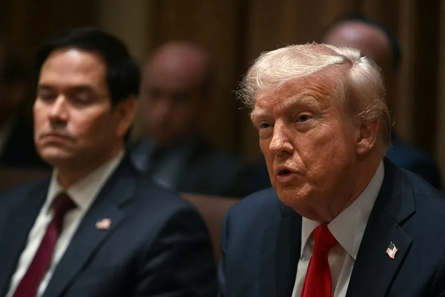 US President Donald Trump speaks as Secretary of State Marco Rubio looks on during a cabinet meeting at the White House in Washington, DC on 26 February 2025. (Jim Watson/AFP)