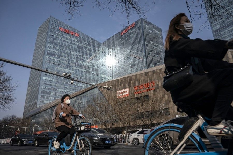 Commuters in the financial district in Beijing, China, on 6 March 2023. (Qilai Shen/Bloomberg)