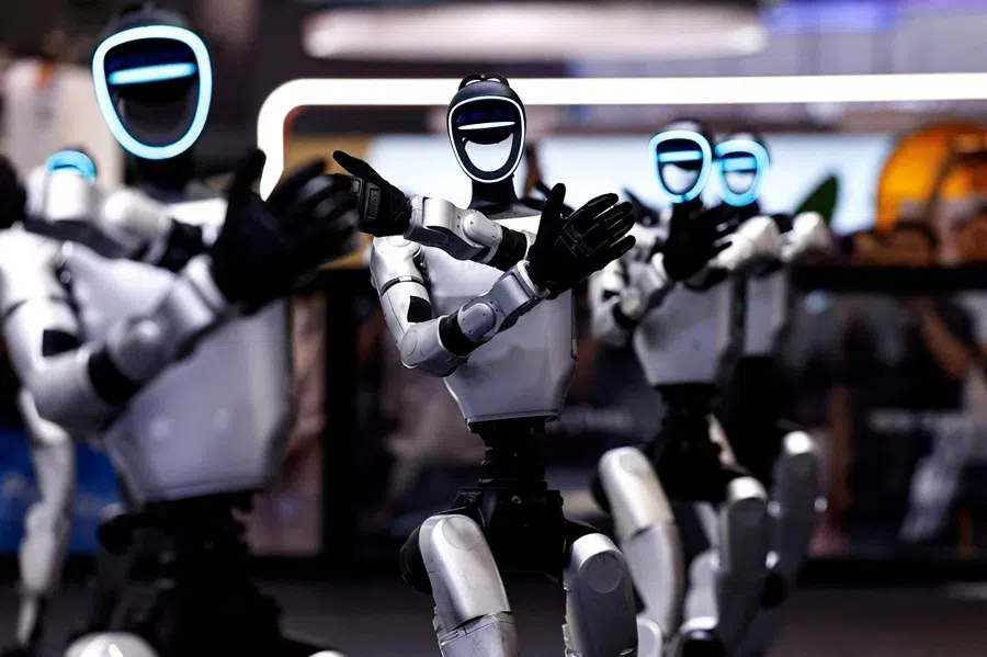 Humanoid robots by Unitree Robotics demonstrate a group dance during the 2026 World Robot Conference, in Beijing, China, on 19 August 2026.