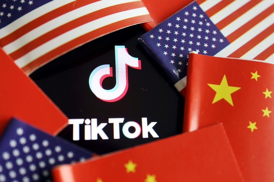China and US flags are seen near a TikTok logo in this illustration picture taken on 16 July 2020. (Florence Lo/Illustration/File Photo/Reuters)